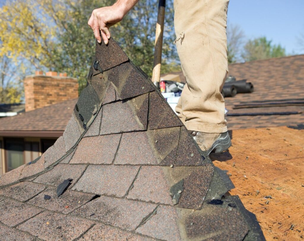 Reliable roofing company in Lenoir, NC inspecting the roof