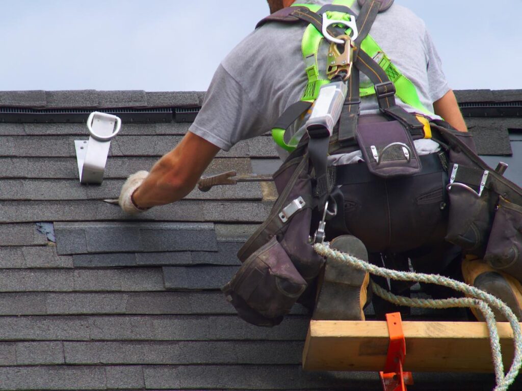 Experienced team performing roof replacement in Weaverville, NC, with expert precision