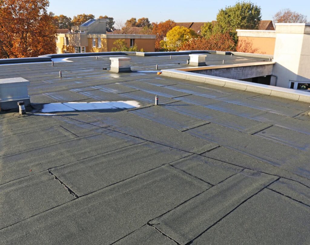 Commercial roofing in Greensboro, NC, installed on a retail center