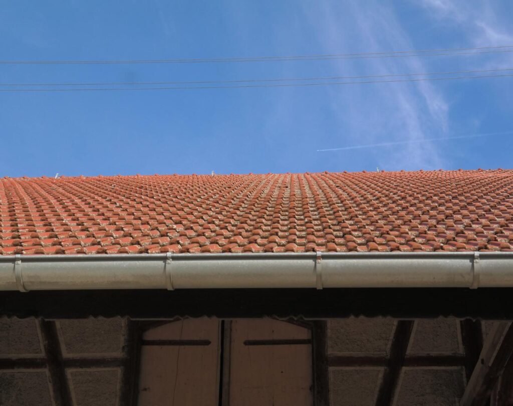 Roofing and gutter company near me in Saluda, NC, installing custom-fit aluminum gutters