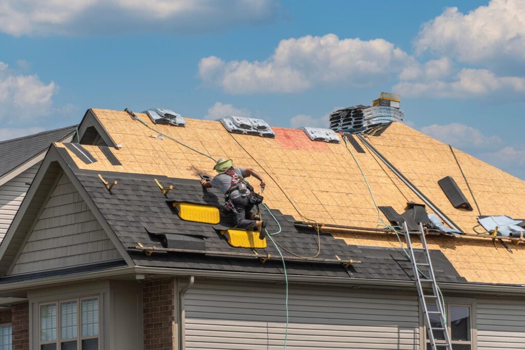 Roofing company near me in Greensboro, NC, installing durable asphalt shingles