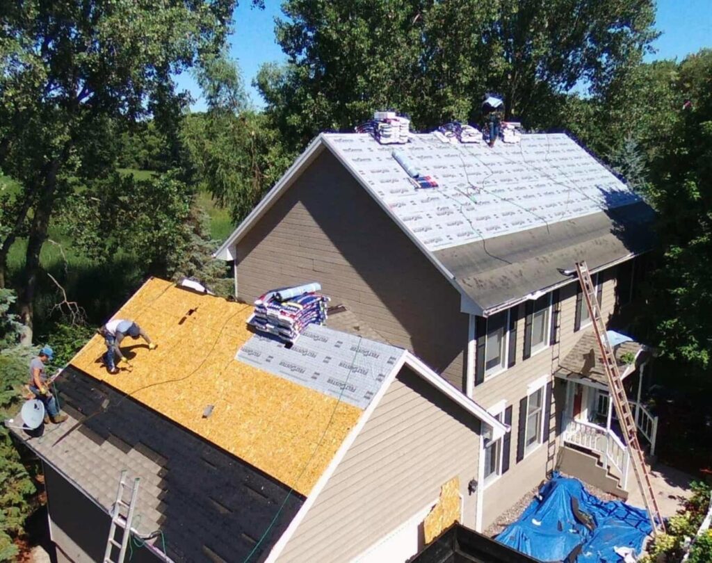 Local roofing company near me in Lenoir, NC, completing a shingle roof installation on a residence